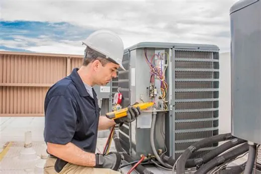 Technician testing an outdoor air conditioner with gauges