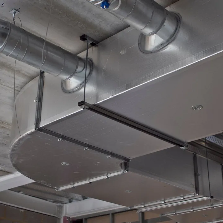 Sheet-metal ductwork running under a ceiling