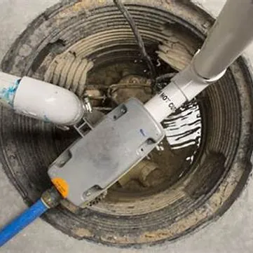 Sump pump and discharge pipe inside a pit